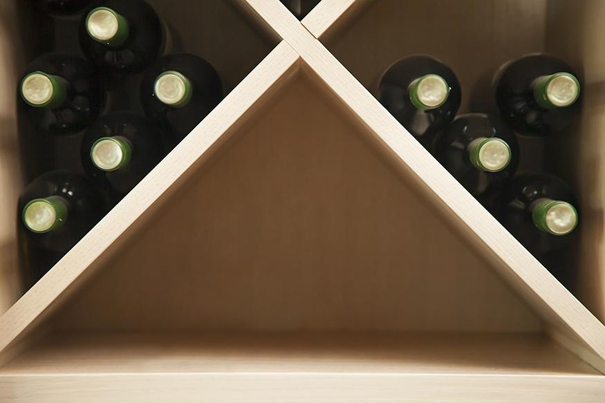 Bottles of white wine on a wine rack